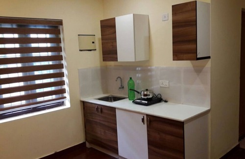 Kodungallur Apartment | Standard One Room Double-Bed Apartment with Fan