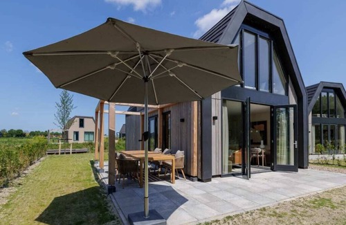 Oude-Tonge House | Stay in comfort in this modern, recently built holiday home with a beautiful view of the water from