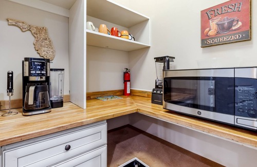 American Beach House | Stay in Style: Gated Townhome + Golf Cart Included