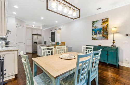American Beach House | Stay in Style: Gated Townhome + Golf Cart Included