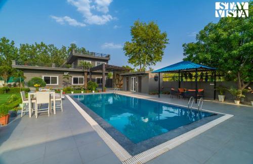 Faridabad Villa | StayVista at Cloudberry Estate - Pet Freindly Villa with Private Outdoor Pool & Lawn