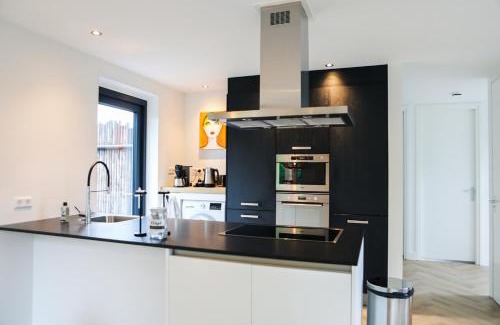 Baarland House | Stijlvol ingerichte (4 pers.) bungalow in Baarland