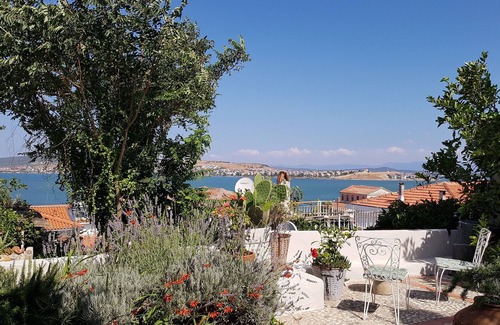 Ayvalik City Center House | Stone Cottage 130 qm with sea view and palmgarden