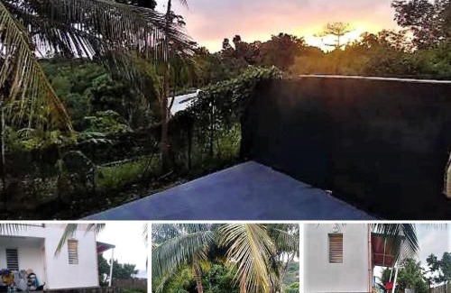 Les Abymes Apartment | Studio avec sa terrasse et son jardinet dans un écrin de verdure