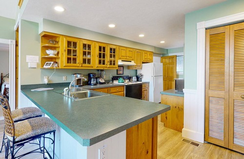 Moultonborough House | Stunning lakefront property with beach access, a dock, spacious yard, & W/D