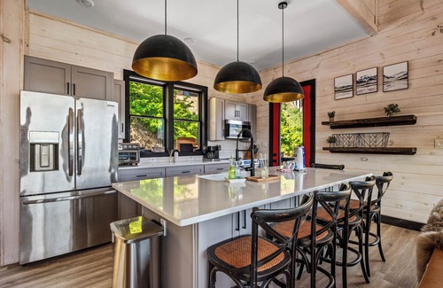 Sevierville Cabin | Stunning Mtn Cabin on Lake w/2 Stry Dock, Indoor Pool, Hot Tub, and Arcade Room