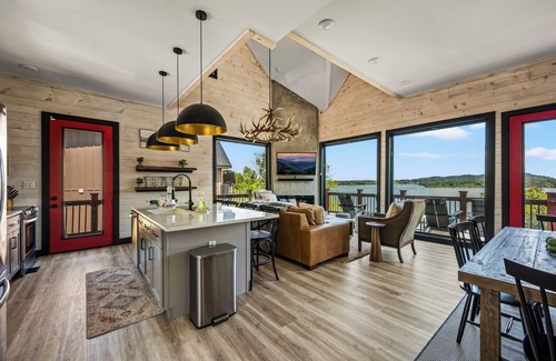 Sevierville Cabin | Stunning Mtn Cabin on Lake w/2 Stry Dock, Indoor Pool, Hot Tub, and Arcade Room