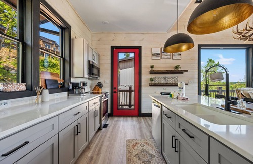 Sevierville Cabin | Stunning Mtn Cabin on Lake w/2 Stry Dock, Indoor Pool, Hot Tub, and Arcade Room