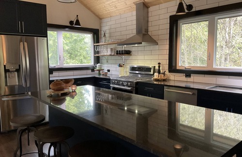 Tofino House | Stunning oceanfront oasis with majestic mountain and lush forest views.