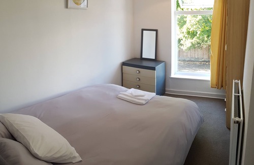 Norwich Apartment | Stylish living with considered workspace.