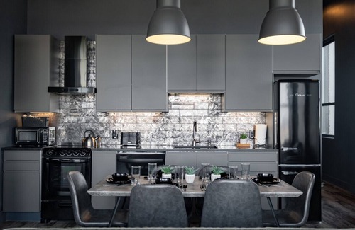 West Main Historic District Condo | Suite 7 City Loft Escape with River Views! By Hollyhock