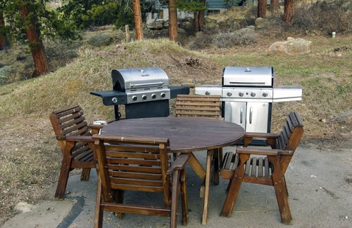 Estes Park Condo | Suite features King bed, full kitchen, and deck with a river view.