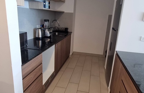 Quito Apartment | Suite La Martina Quito, 2 Personas en La Carolina ¡A 5 Minutos del Metro!