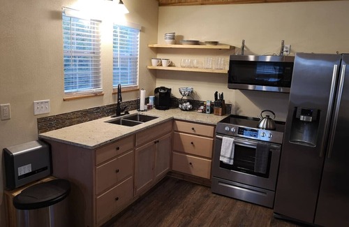 Paluxy Cabin | Sunflower - Hot Tub on porch - City Escapes Cabins