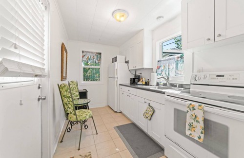 Parrot Cove House | Sunny 2-bedroom Beach Bungalow in Lake Worth Beach just steps from the ocean!