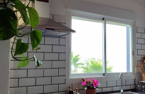 Buen Paso Apartment | Sunny balcony, large garden and private parking, 10 minutes from the beach.