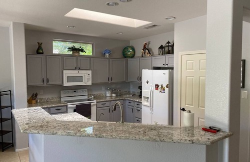 Surprise House | Sunny Cul De Sac Oasisnn