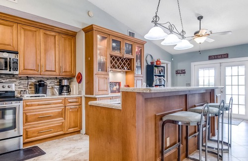 Lake Worth House | Sunny home with private screened pool, spacious patio & fast WiFi