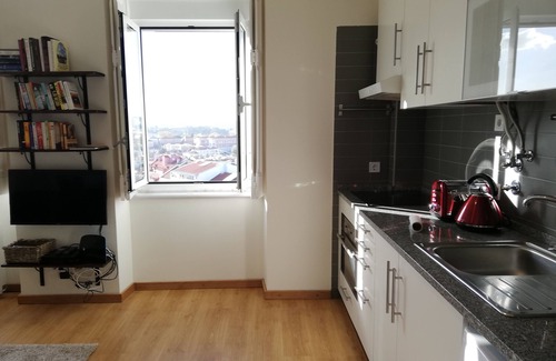 Alfama Apartment | Sunset over the roofs of Lisbon