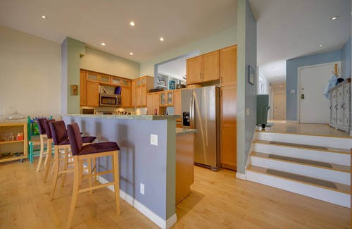 Marina Peninsula Condo | Sunsets and sweeping views, sliding doors open to the sand