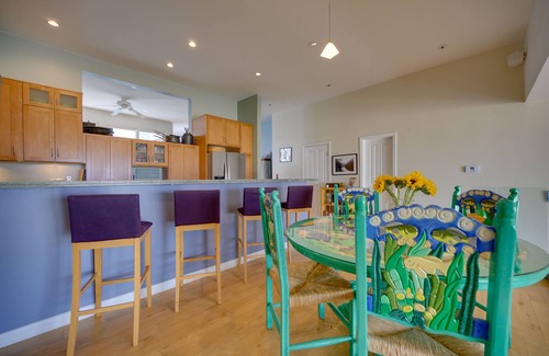 Marina Peninsula Condo | Sunsets and sweeping views, sliding doors open to the sand