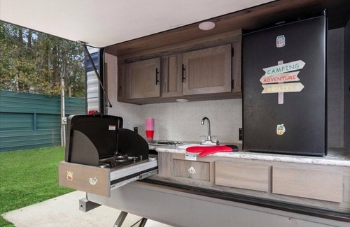 Milton RV Rental | Super- fun camper with plenty of room for a full-size family, lots of comfy beds + full kitchen, bath, and separate bedroom for Mom & Dad. There's even a nice patio with outdoor kitchen and seating area for barbecues, bacon & eggs in the morning, et