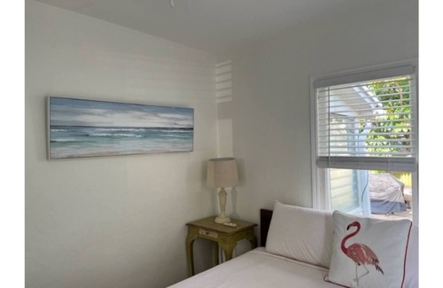Mango Groves Cottage | Surf Inn our Beachy Cottage- King Bed w/Fenced Patio