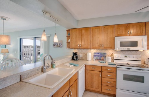Cocoa Beach Condo | Sweet Cocoa Beach Remodeled Retreat ~ Heated Pool, Spa ~ 2 Sunny Balconies