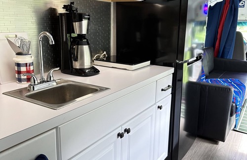 Black Creek RV Rental | Tailgating Bus on Ischua Creek @ Campground Adventures