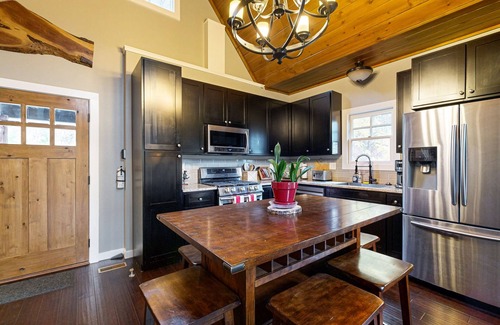 Cullowhee House | Take in the natural beauty from this elegant riverfront home