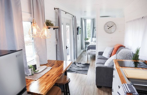 Mingoville Cabin | The Bellefonte Campground presents: The Luxury Hideaway Container Home, hot tub, Rooftop veranda, and more.