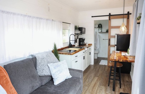 Mingoville Cabin | The Bellefonte Campground presents: The Luxury Hideaway Container Home, hot tub, Rooftop veranda, and more.