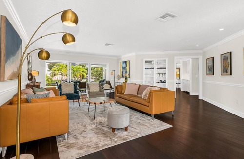 Lake Ida Shores House | The Coconut Canal Hideout- Waterfront, Heated Pool, Minutes to Downtown Delray!