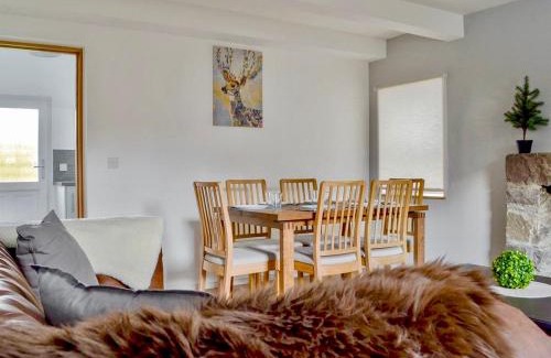 Strathcarron House | The Coolins cottage with wood burner