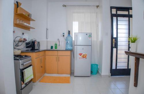 Riruta Apartment | The Cozy Nest with Pool, Gym and Netflix