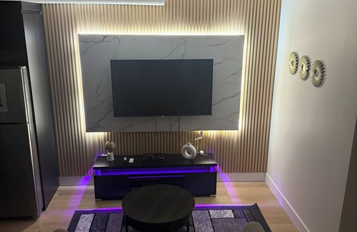 Northeast Edmonton House | The Cozy Parlor- a stylish and family-friendly space that feels just like home.