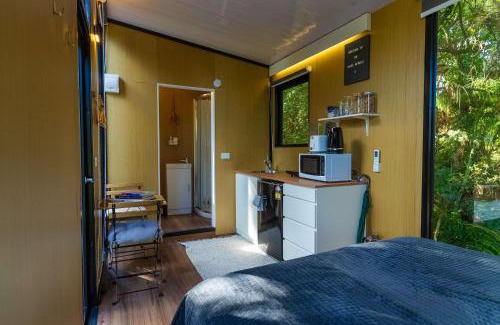 Waitoki House | The Kauri Sanctuary by Tiny Away