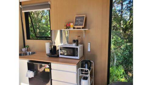 Waitoki House | The Kauri Sanctuary by Tiny Away