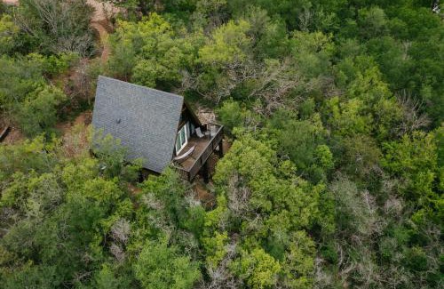 New Braunfels Ski Chalet | The Maverick: A-Frame w/Hammock and Tree Top View