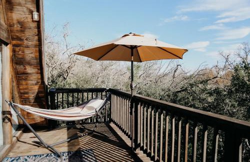 New Braunfels Ski Chalet | The Maverick: A-Frame w/Hammock and Tree Top View