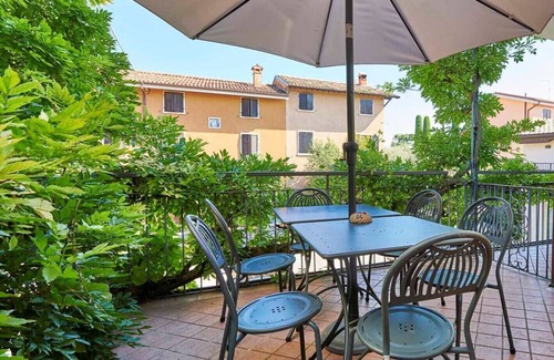 Lazise Apartment | Three-room apartment Lake Garda view wi-fi smart TV air conditioner table on terrace