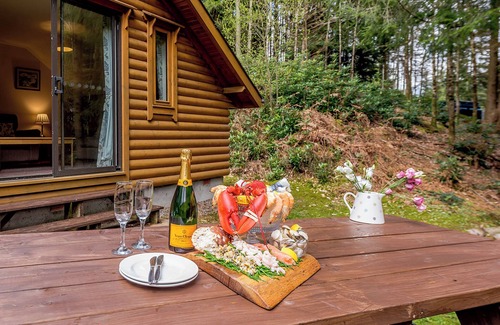 Westleigh Ski Chalet | Timber lodge set in an elevated position with views of the lake.