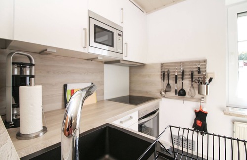 Norddeich Apartment | Tobi's Kajüte Freundliche Obergeschosswohnung in Norddeich für 4 Personen + Baby
