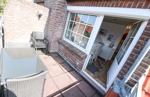 Norddeich Apartment | Tobi's Kajüte Freundliche Obergeschosswohnung in Norddeich für 4 Personen + Baby