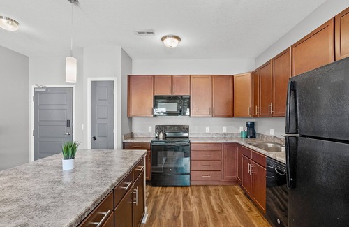 West Des Moines Apartment | Top Floor! Garage Included + New Onsite Gym!
