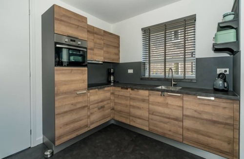 Oude-Tonge House | Tough and industrial with lots of space around the house for storing your fishing or cycling equipme