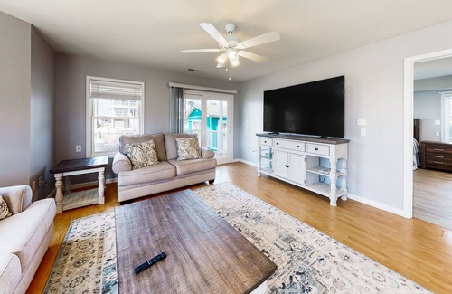 Cedar Neck House | Town of Ocean View canal-front home with dock, kayaks, balconies, grill, & AC