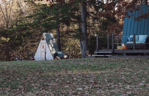 Kingston RV Rental | Two cozy pods with water tower