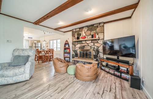 South Haven Cottage | Unwind in Riverfront Comfort — Hot Tub, Fire Pit, Boat Slip, Kayaks