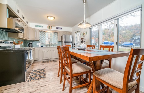 South Haven Cottage | Unwind in Riverfront Comfort — Hot Tub, Fire Pit, Boat Slip, Kayaks